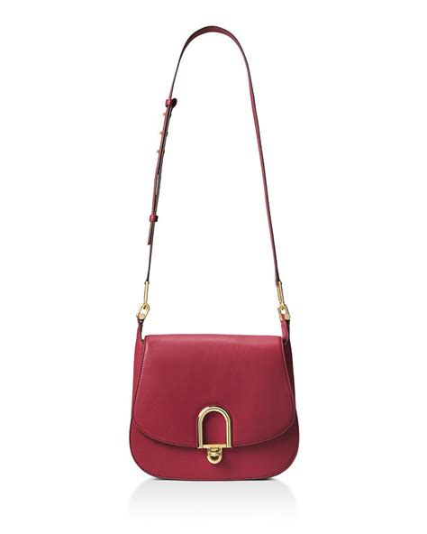 michael michael kors delfina large saddle bag|Michael Kors black rainbow bag.